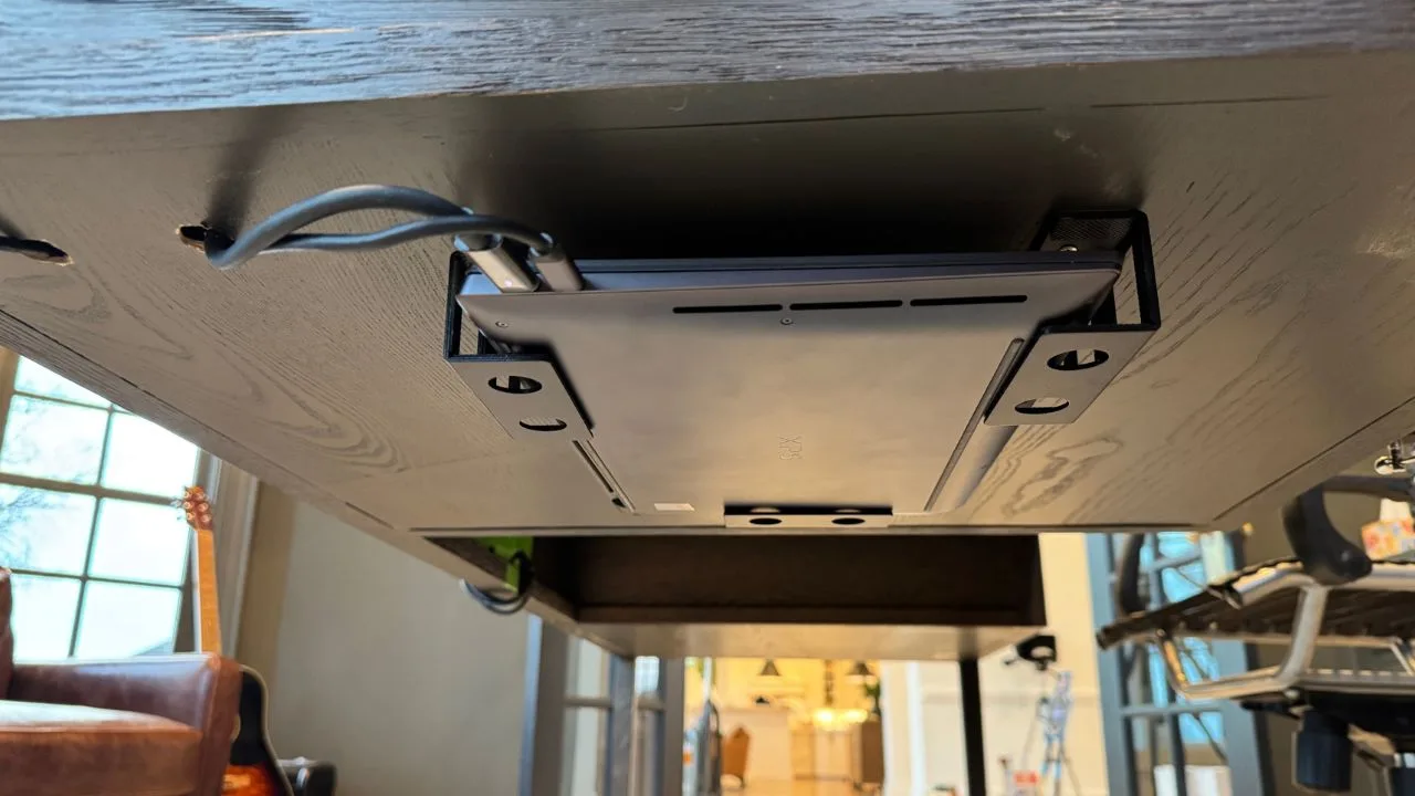 My laptop mounted underneath my desk